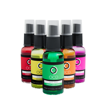 Set of five colorful OCD spray bottles on a white background