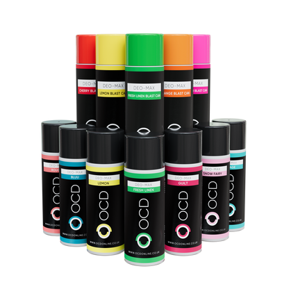 Assorted OCD spray cans with colorful labels on a white background